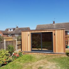 Bright blue skies to finish off a lovely few days building this stunning, sleek CUBE design ⏹ 🩵🟦

We LOVE the symmetry this build delivers!🪞

Our customer chose sliding doors to sit central on the building which ties in nicely with the vertical lines of Western Red Cedar cladding and the arrangement of graphite up/down lights either side. ⚖️

All our windows and doors are made to order which means the choice is yours!🫵🪟 We’d always recommend having one opening window in your building which is convenient because all our garden rooms come standard with one included!😀

To find out what else our garden rooms come with get in touch:
07762706171 / ￼⁨07557 868533⁩
info@contemporarygardenrooms.uk

#gardenrooms #gardenoffice #symmetry #slidingdoors #gardenpod #gardenroom